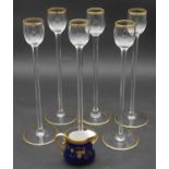 A set of six French gilt crystal tall stemmed liqueur glasses along with an M. Redon Limoges