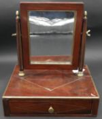 A 19th century French Empire style mahogany swing toilet mirror with brass inlay and fitted with