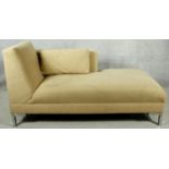 A contemporary chaise longue in faux suede upholstery on chrome supports. H.80 W.155 D.70cm