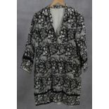 A vintage black silk kimono finely embroidered with bridges, trees and flowers. L.95cm