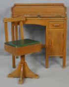 A vintage beech and ply child's desk with tambour roll top and the matching swivel desk chair. H.