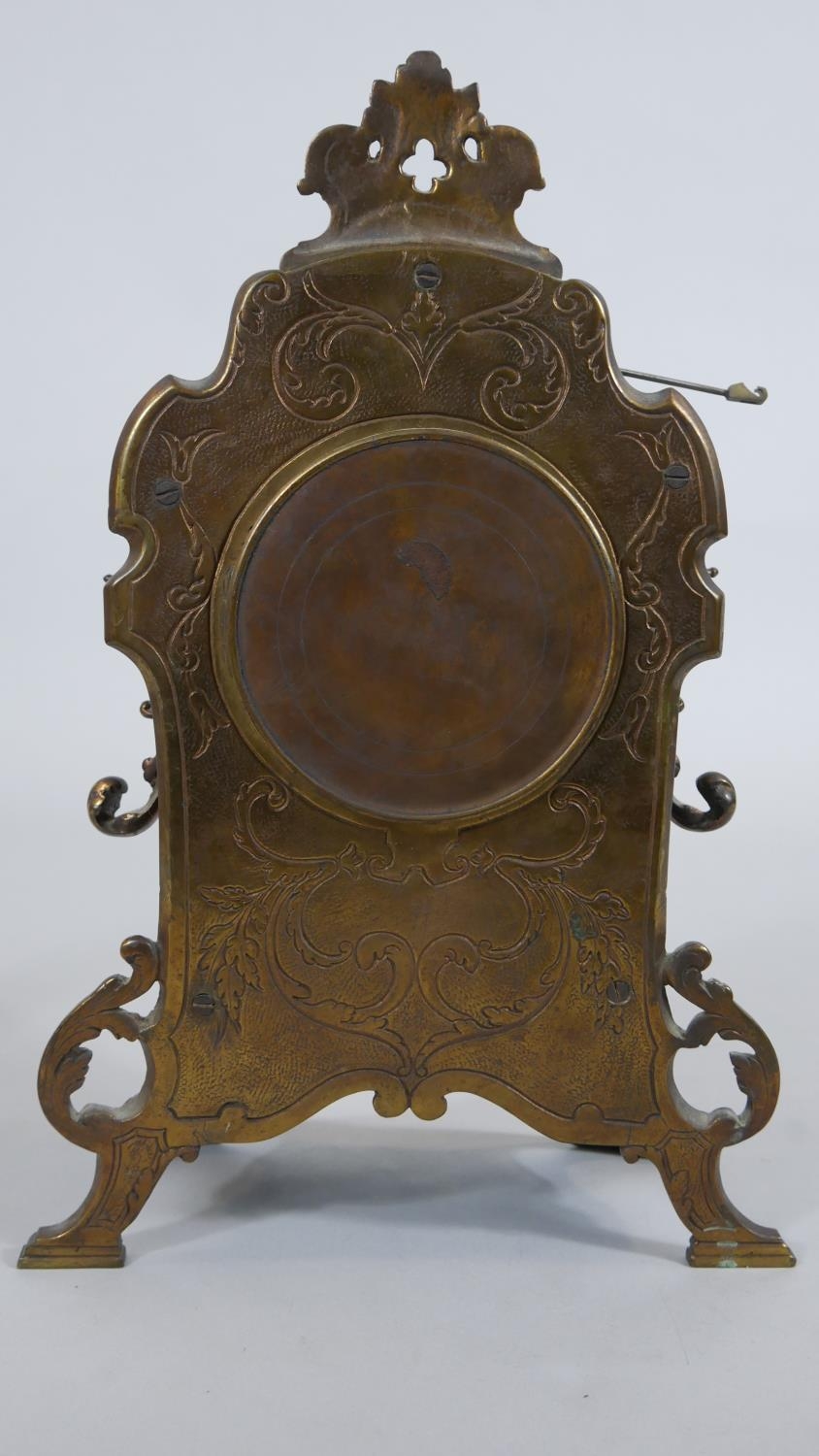 A French style brass mantel clock in scrolling Rococo case with enamel Roman numerals and eight - Image 4 of 7