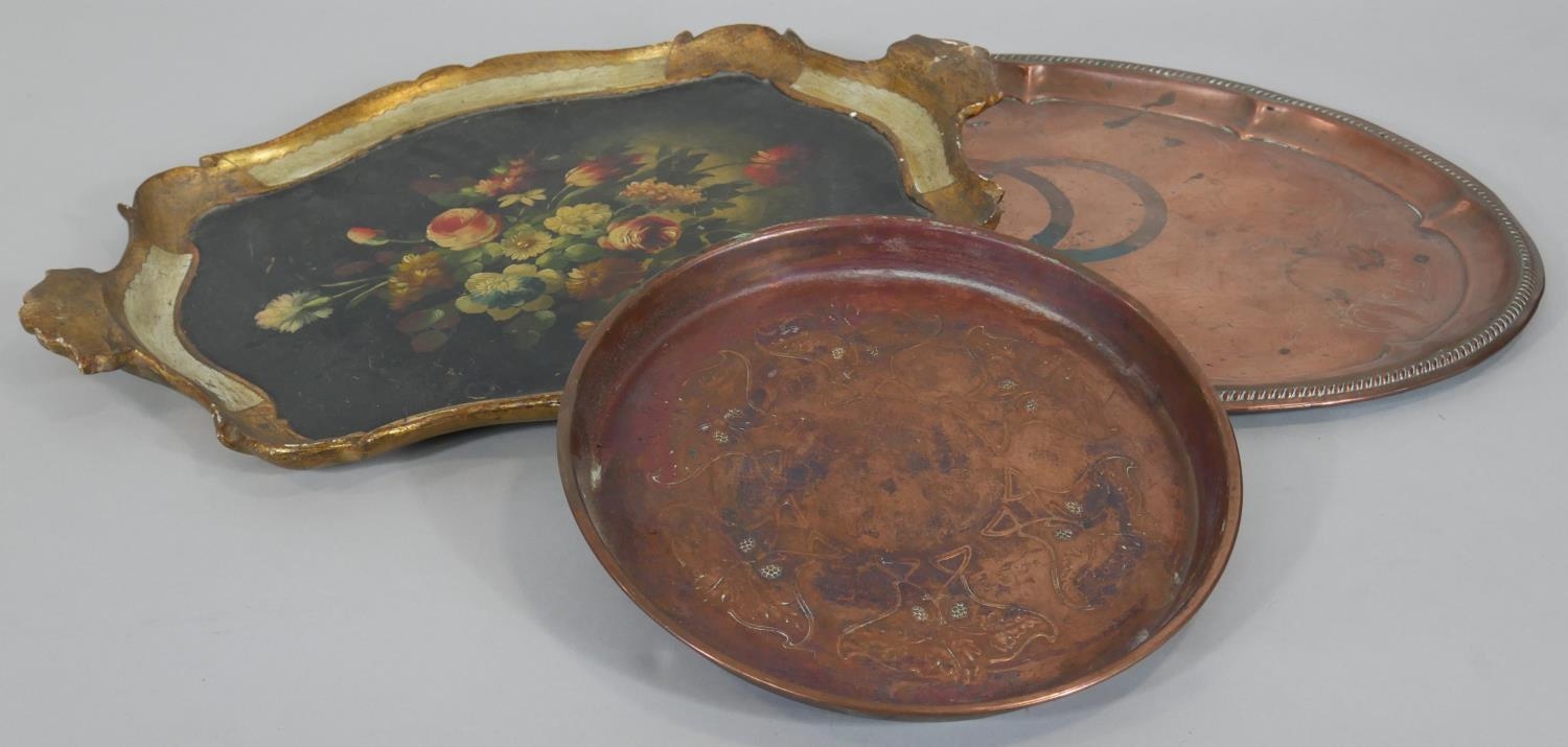 An Italian carved and gilt twin handled tray with hand decorated floral decoration along with two