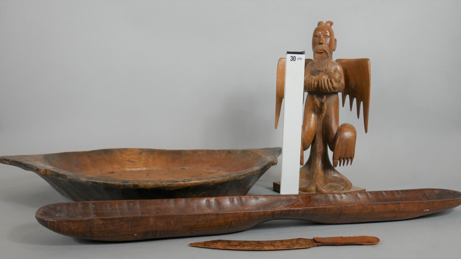 A collection of carved wooden items. Including an oriental carved statue of a deity, a two handled - Image 9 of 9