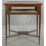 An Edwardian mahogany, satinwood crossbanded and ebony strung vitrine on square tapering supports
