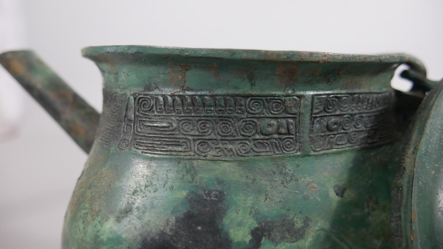 A Chinese bronze archaistic ritual pouring vessel, with character mark to the base. H.23cm - Image 3 of 7