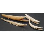 A collection of four carved bone crocodile figures. L.20cm