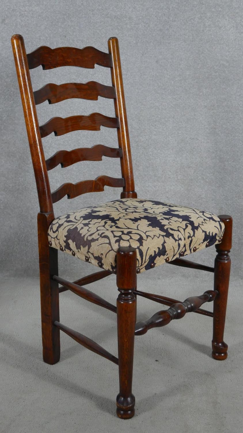 A set of eight oak Lancashire ladderback dining chairs in floral upholstery on turned stretchered - Image 6 of 9