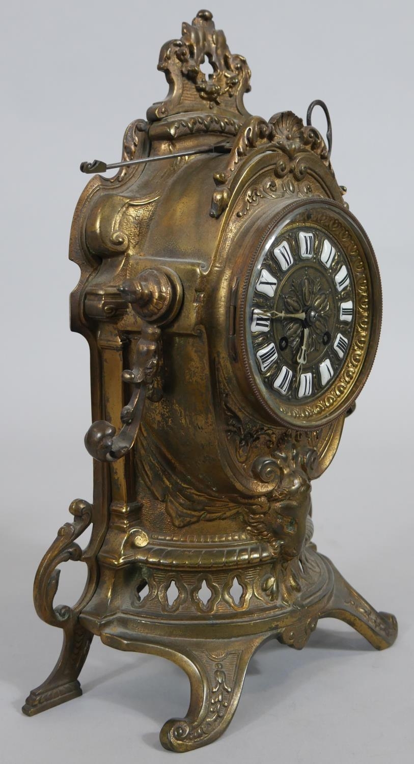 A French style brass mantel clock in scrolling Rococo case with enamel Roman numerals and eight - Image 2 of 7