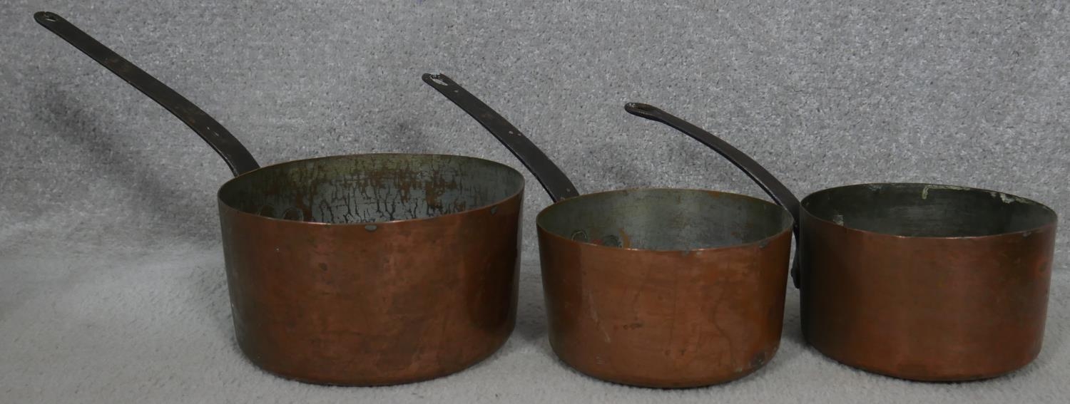 A 19th century brass swing handled jam pan and a miscellaneous collection of copper and brass pans - Image 6 of 7