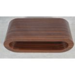 A contemporary laminated zebra wood effect low table. H.36 L.90.5 W.34.5cm