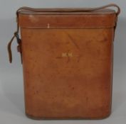 A vintage leather flask or bottle holder. H.38 L.33 W.13cm