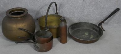 A 19th century brass swing handled jam pan and a miscellaneous collection of copper and brass pans