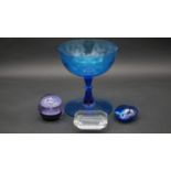 A Tiffany and Co glass paperweight, a Caithness paperweight numbered and marked Ice Fountain, a blue