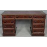 A mid 19th century mahogany three section pedestal desk with inset faux leather top above