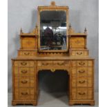 A late 19th century Aesthetic style walnut dressing table with incised carved decoration and ebony