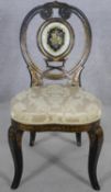 A Victorian papier mache side chair hand decorated with floral gilt and inlaid coloured glass in