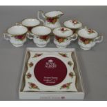 Six Royal Albert 'Old Country Roses' tea cups and a boxed matching photo frame. L.24.5 W.19.5cm (
