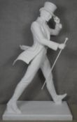 A life size white fibreglass figure of Johnnie Walker on a rectangular base, stamped Johnnie Walker.