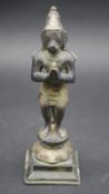 An early 20th century Indian bronze statue of the monkey god Hanuman with white metal clothes and