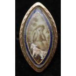 A Georgian red metal mourning ring, the navette-shaped ivory panel painted en grisaille to depict