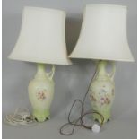A pair of table lamps and shades converted from hand painted Victorian ewers. H.80cm