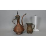 An 18th century copper samovar and vintage gadrooned copper jug. The samovar has a snake form handle