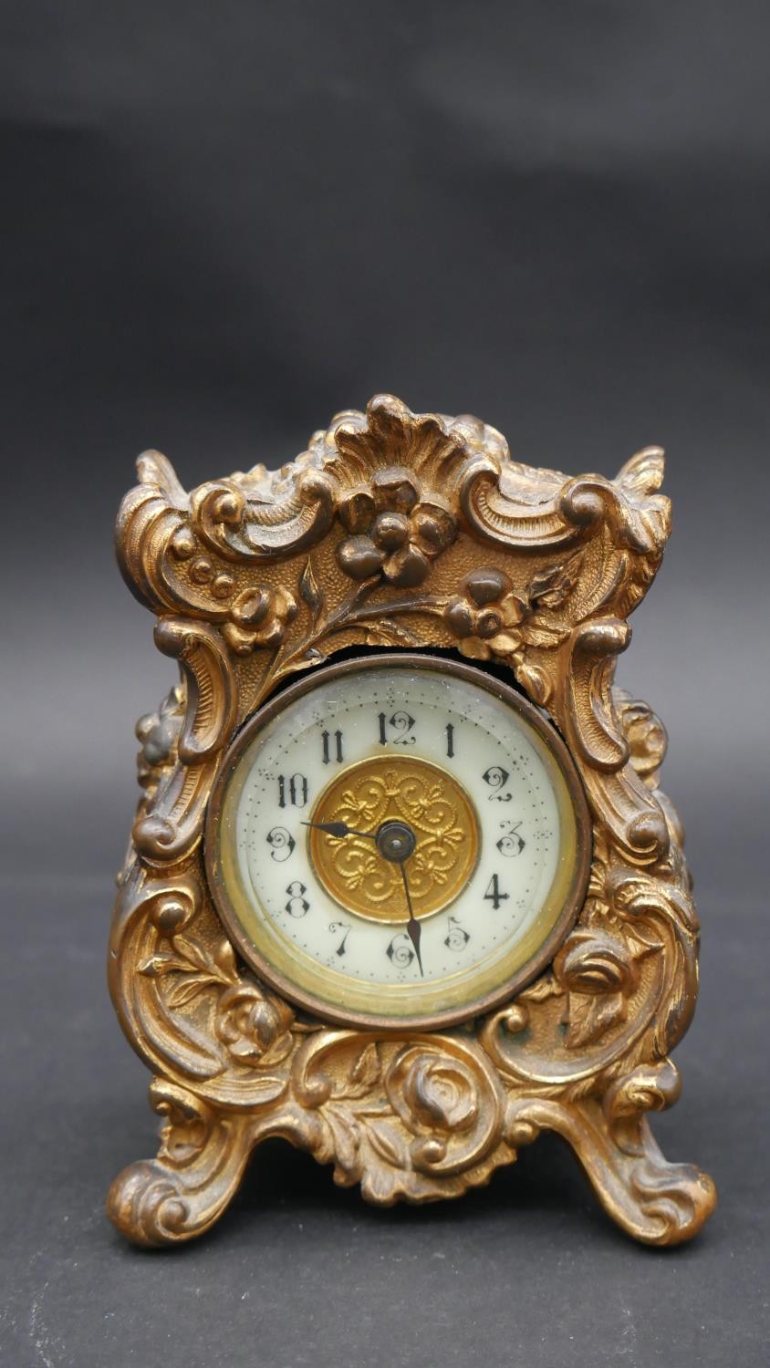 An antique gilt metal carriage clock by The British United Clock Company Birmingham and France.