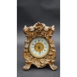 An antique gilt metal carriage clock by The British United Clock Company Birmingham and France.