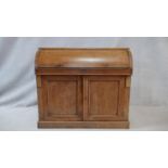 A 19th century mahogany cylinder top bureau with fitted interior and pull out leather inset