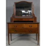 An Edwardian mahogany and satinwood with ebony strung dressing chest fitted with bevelled swing