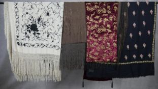 Four embroidered shawls. Including two silk floral embroidered scarves, one cream and one brown. A