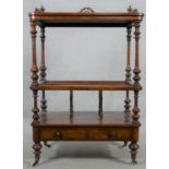 A Victorian burr walnut and satinwood inlaid Canterbury whatnot with pierced galleried back above