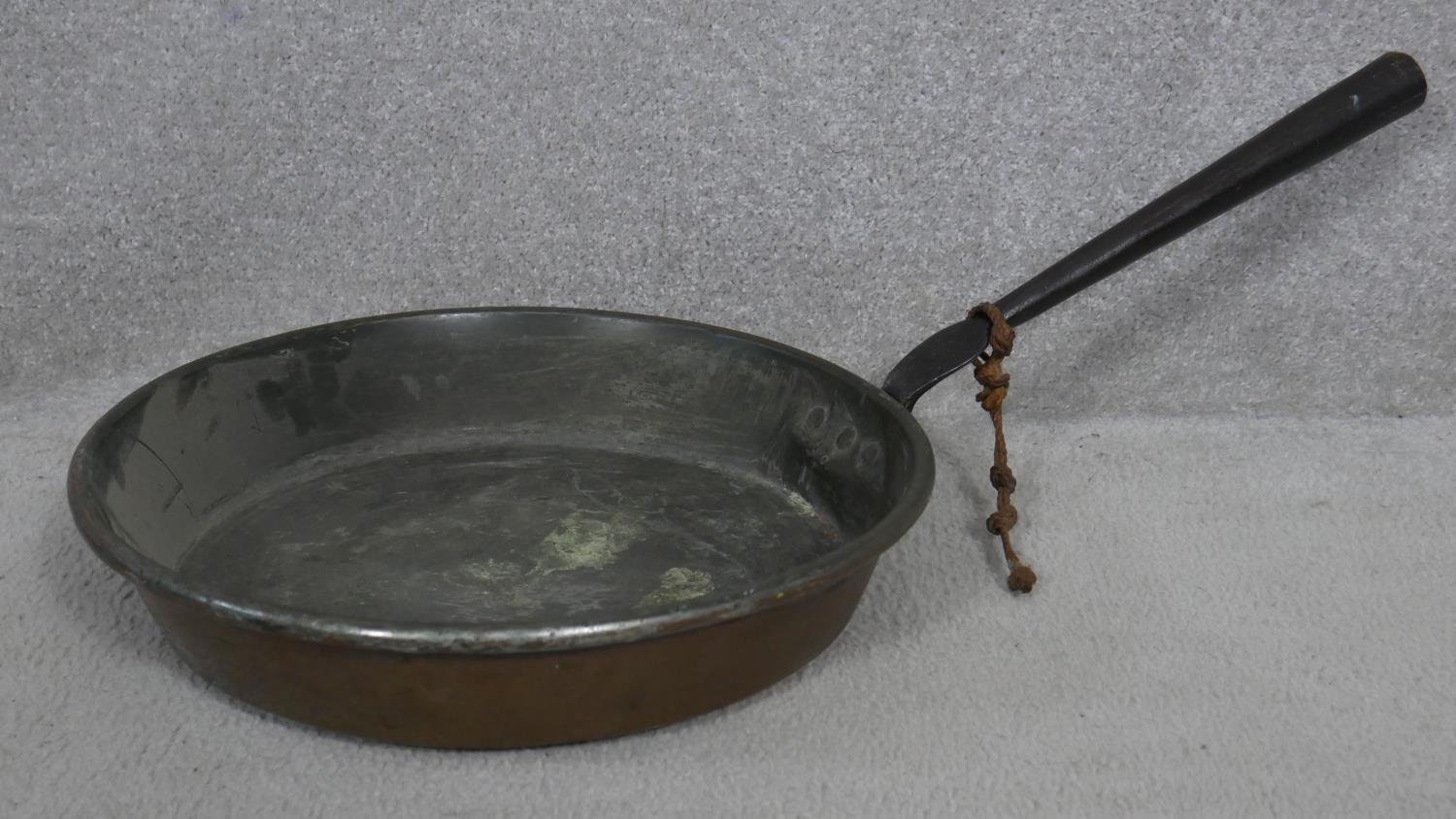 A 19th century brass swing handled jam pan and a miscellaneous collection of copper and brass pans - Image 5 of 7