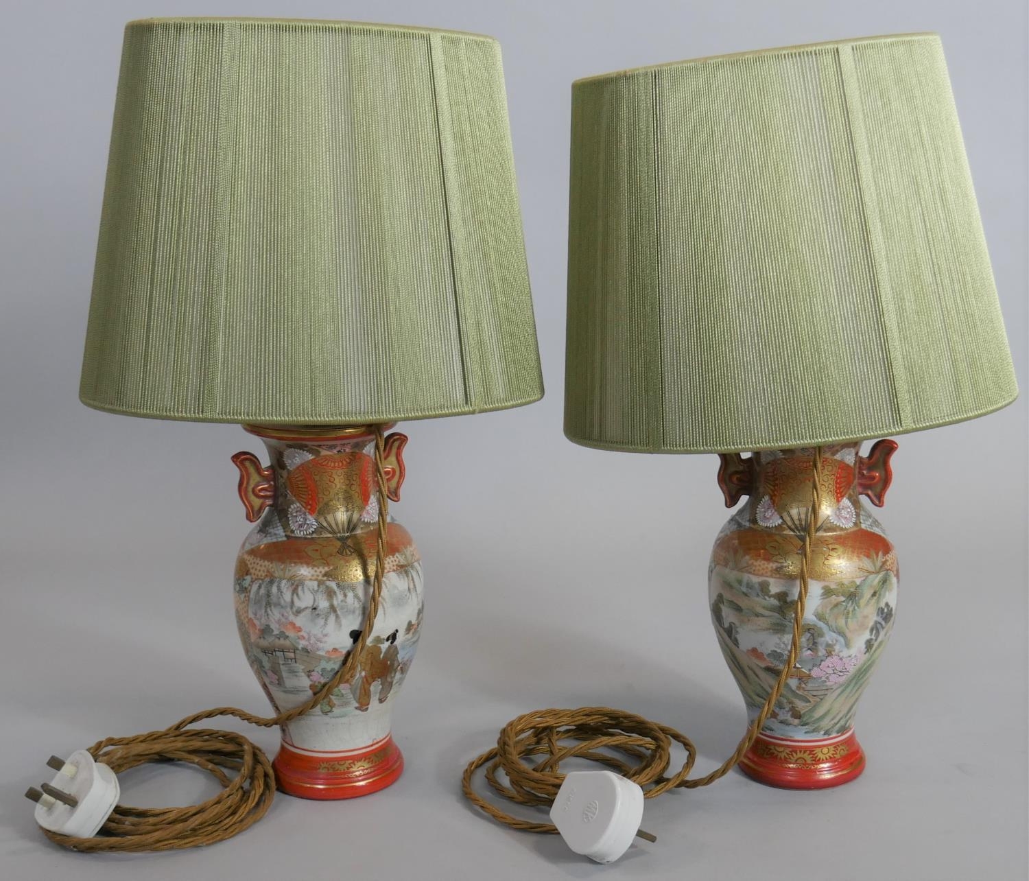 A pair of mid century table lamps and shades in the form of Japanese twin handled baluster form