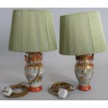 A pair of mid century table lamps and shades in the form of Japanese twin handled baluster form
