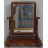 A Victorian mahogany swing toilet mirror on shaped platform base. H.50 W.42.5 D.20cm