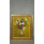 A gilt framed oil on canvas laid on board, still life flowers, signed Penelope Kidston. W.55 H.61cm