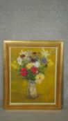 A gilt framed oil on canvas laid on board, still life flowers, signed Penelope Kidston. W.55 H.61cm