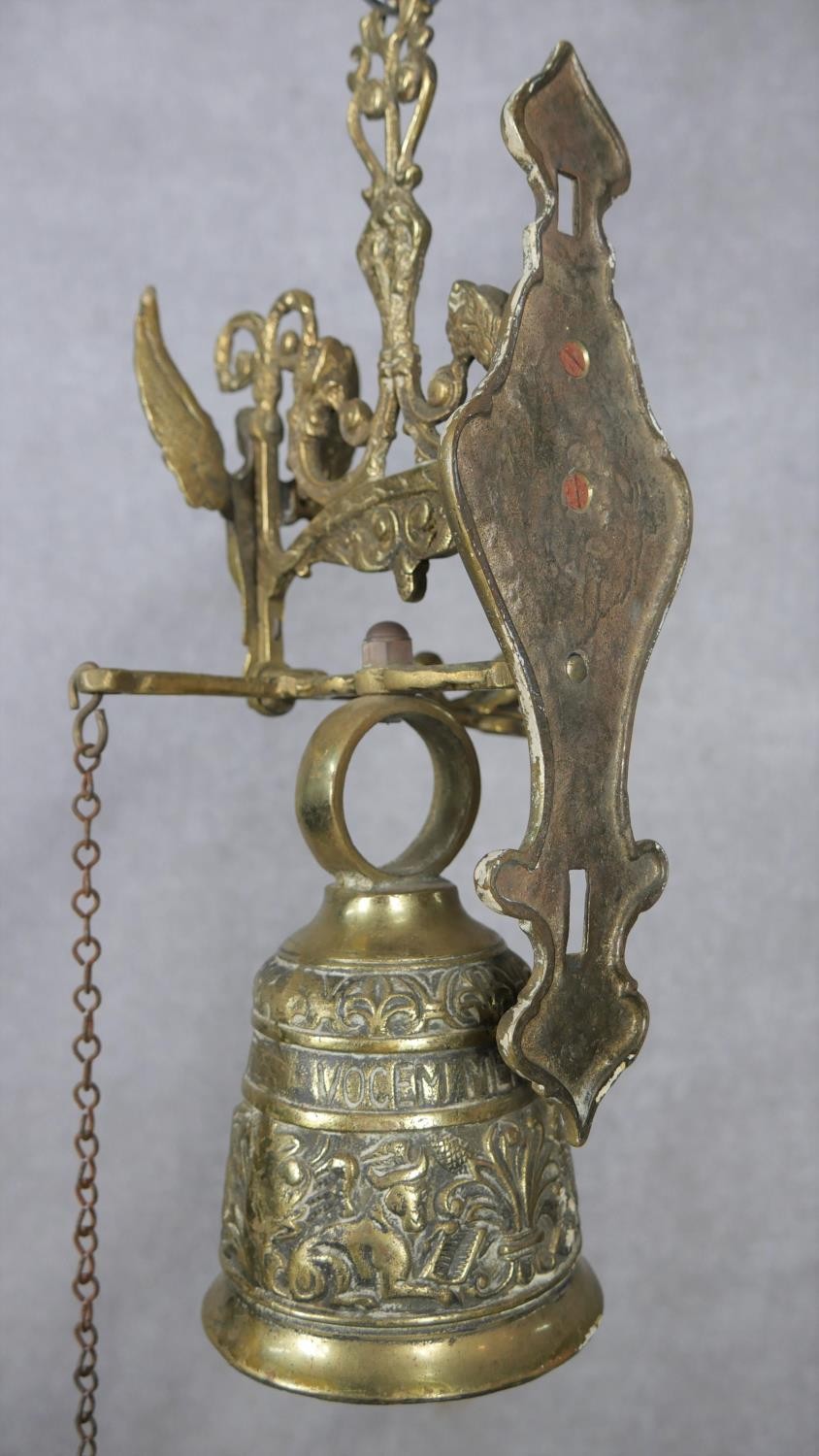 A 20th century French brass gothic style wall mounted bell with relief foliate and figural - Image 3 of 5