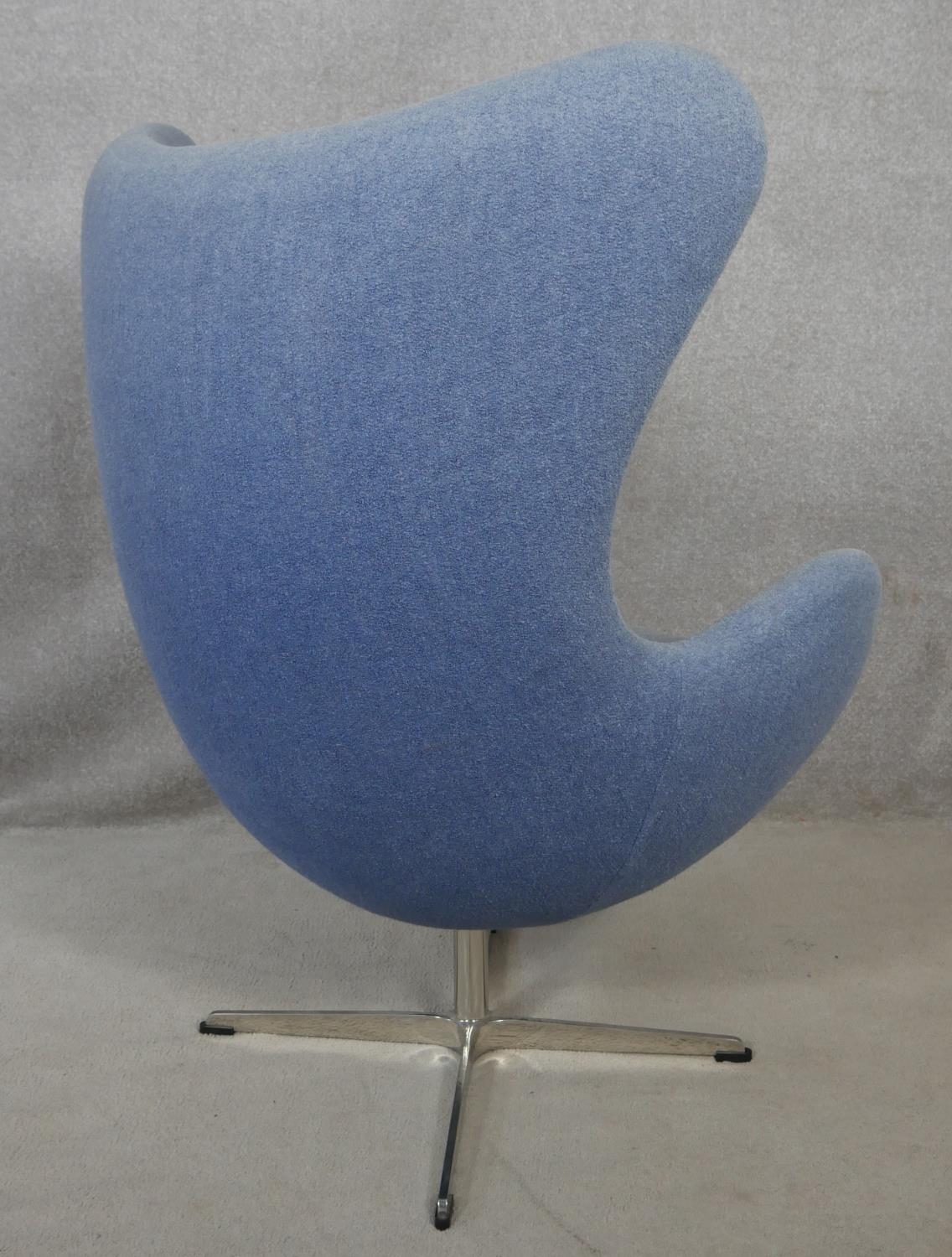 After Arne Jacobsen (1902-1971) Egg chair in pale blue upholstery and rise and fall action on four - Image 3 of 4