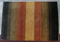 A woollen carpet with polychrome bands. L.250 W.170cm