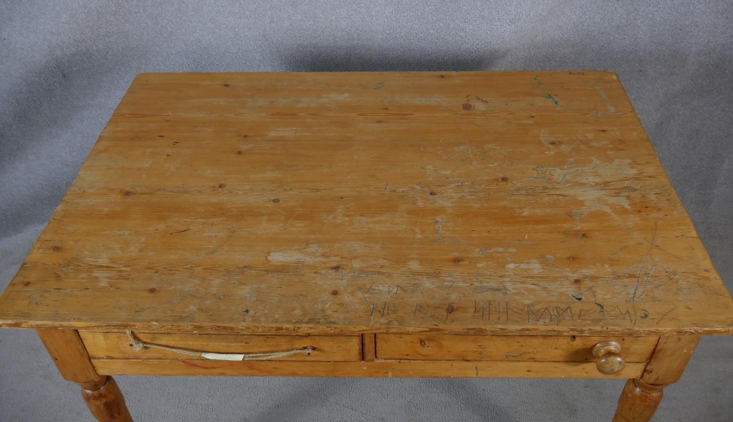 A Victorian pine two drawer side table on turned tapering supports. H.64.5 L.121 W.83cm - Image 4 of 8