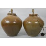 A pair of baluster shaped stoneware table lamps. H.45cm