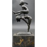 A bronze figure group, children playing leapfrog with impressed mark, raised on marble base. H.28cm