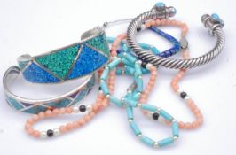 A collection of silver and gemset jewellery. Including a lapis and turquoise mosaic silver cuff