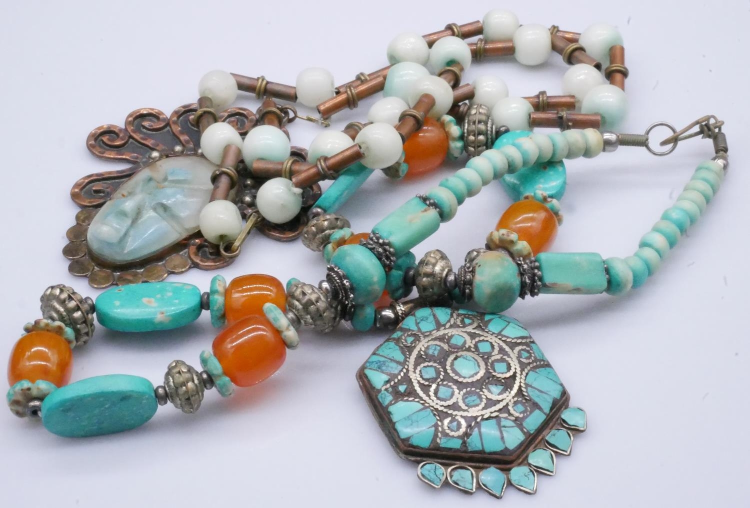 A collection of costume jewellery. Including turquoise and amber necklace, horn disc necklace and - Image 3 of 4