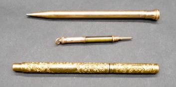 Three gold plated pens and pencils. Including a Swan engraved scrolling design rolled gold pen,