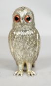 A vintage cast silver plate Corbell & Co. sugar shaker in the form of an owl, with glass eyes.