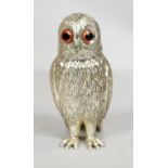 A vintage cast silver plate Corbell & Co. sugar shaker in the form of an owl, with glass eyes.